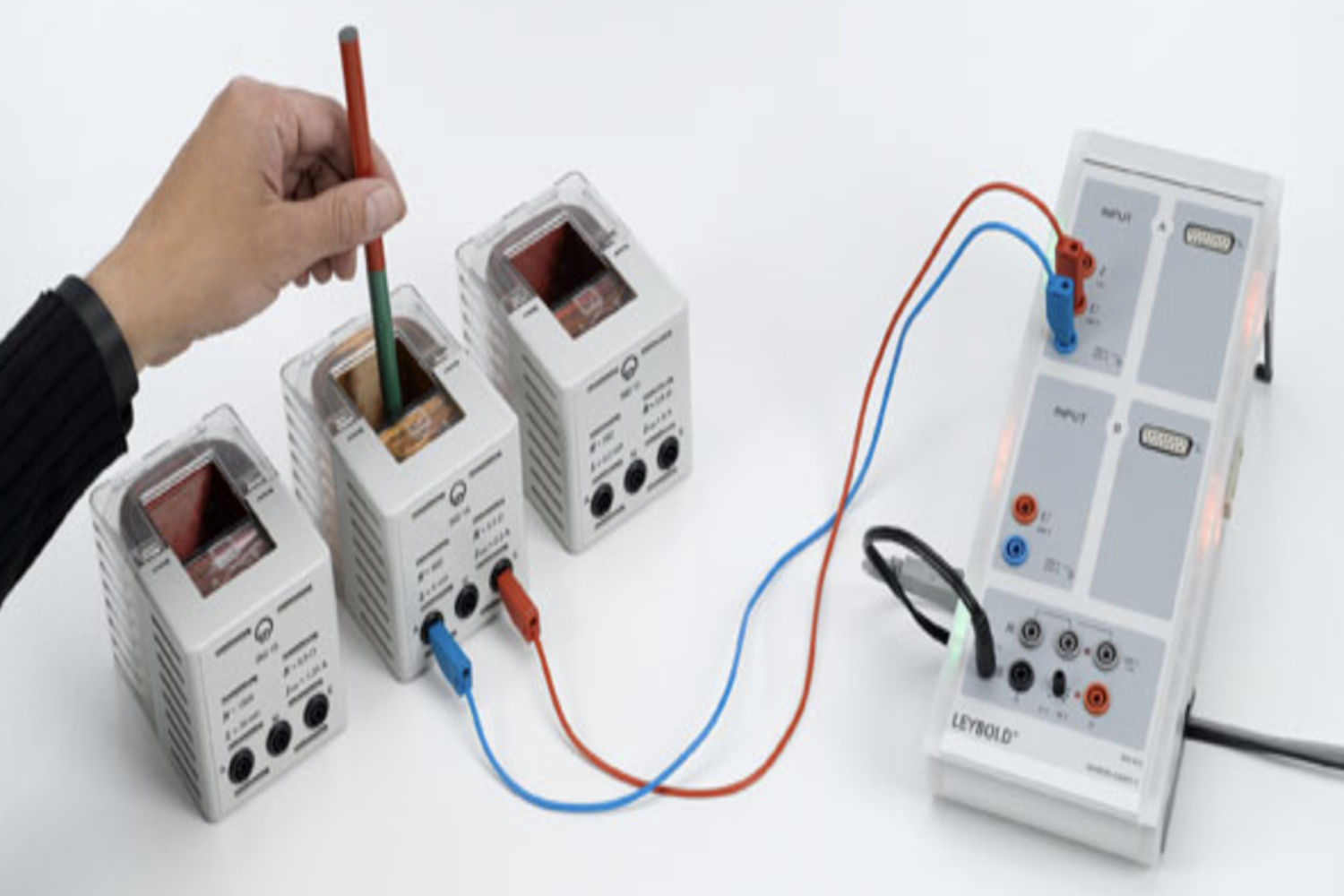 Generating a voltage surge in a conductor loop with a moving permanent magnet